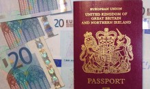 British passport with 20 Euro notes