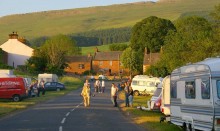 Travellers caravans by side of road in English village
